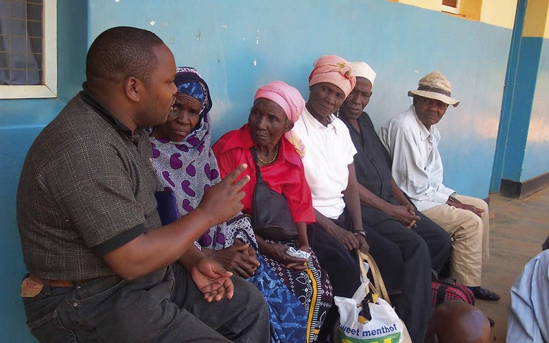 5546697817_5fbf8c94a4_b Advocacy at the community level: A community coordinator talks with village leaders about gender and the use of cataract services. TANZANIA. © Paul Courtright