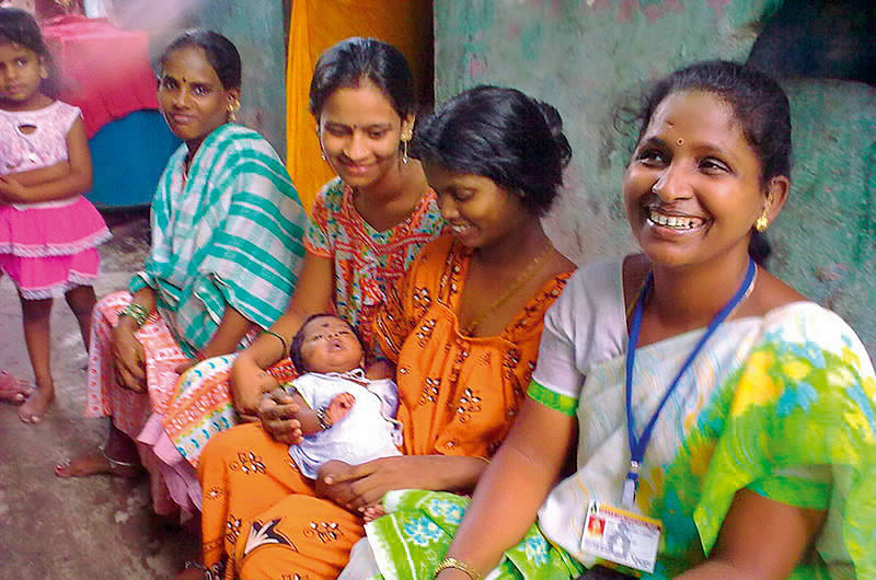 A-female-eye-care-worker-right-supports-mothers A female eye care worker (right) supports mothers in the Mumbai community where she lives. INDIA © Shilpa Vinod Bhatte